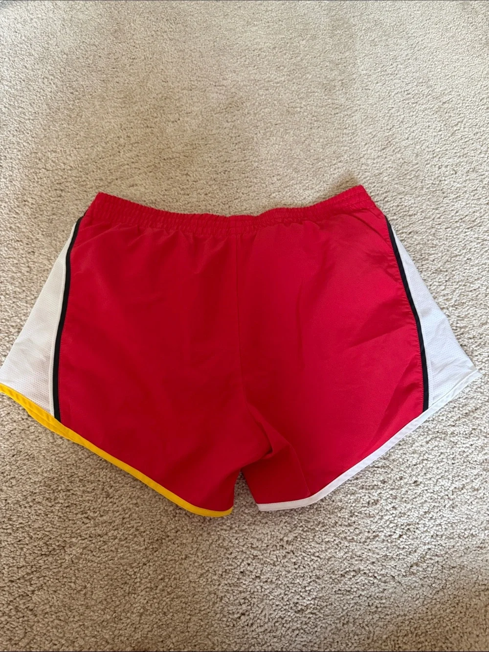 Nike Women's Red Athletic Shorts with White and Yellow Trim